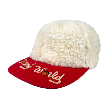 White fleece-lined cap with red brim and 'World's World' embroidery on a white background